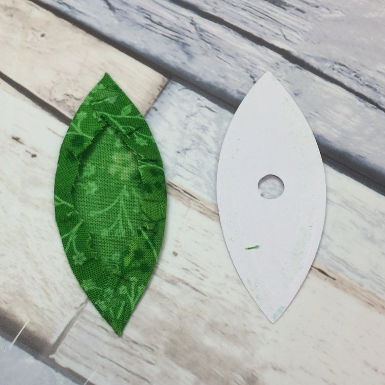 EPP leaf piece with removed paper template alongside